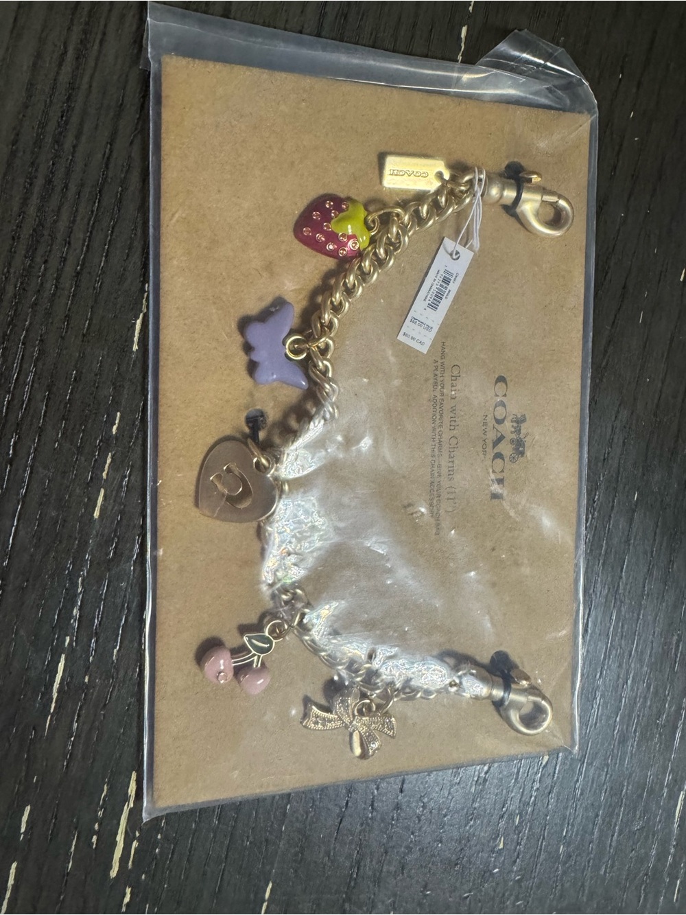 Coach Gold-Tone Charm Bracelet with Pink, Purple & Red Accents